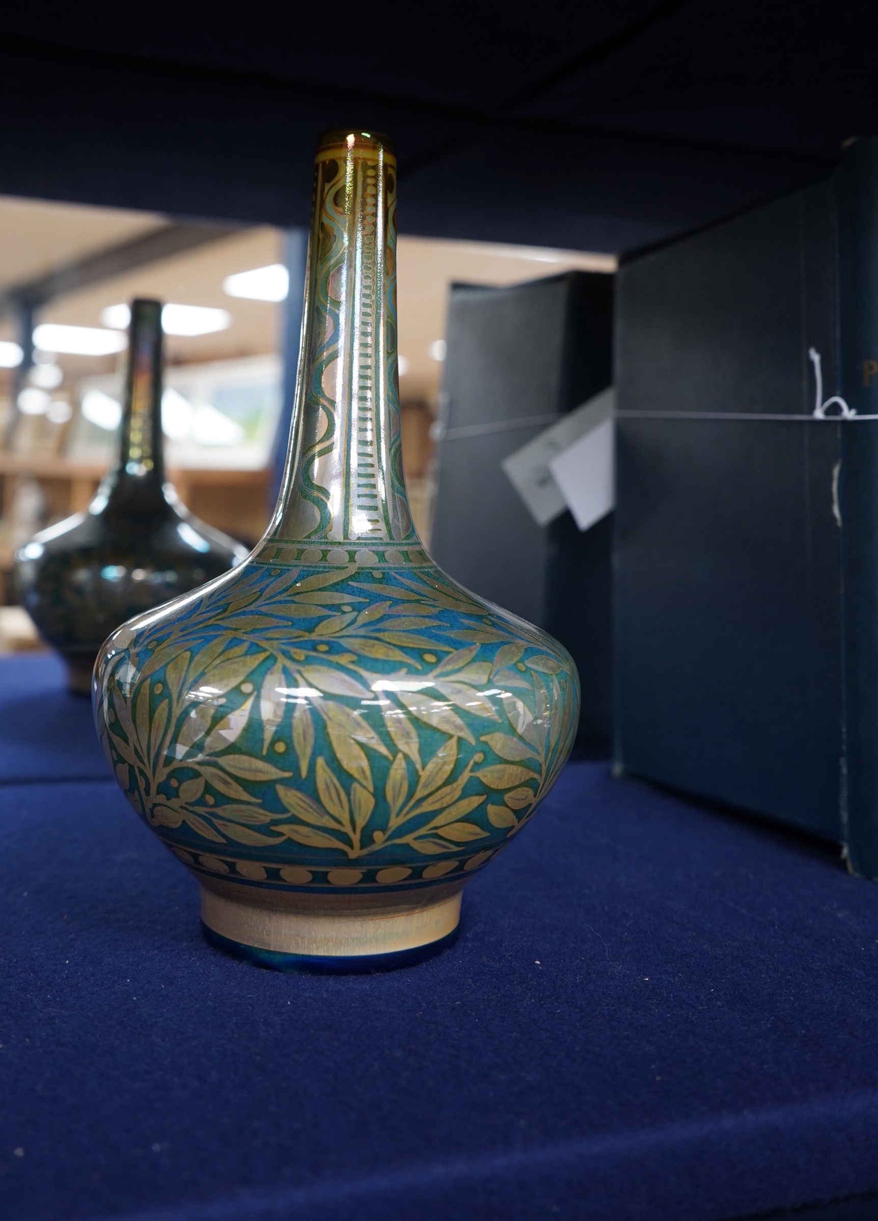 A Pilkington’s Royal Lancastrian lustre bottle vase by William S Mycock, decorated with foliage, 22cm high. Condition - good.